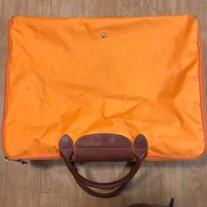 Long champ foldable suite case. Marks on bag.